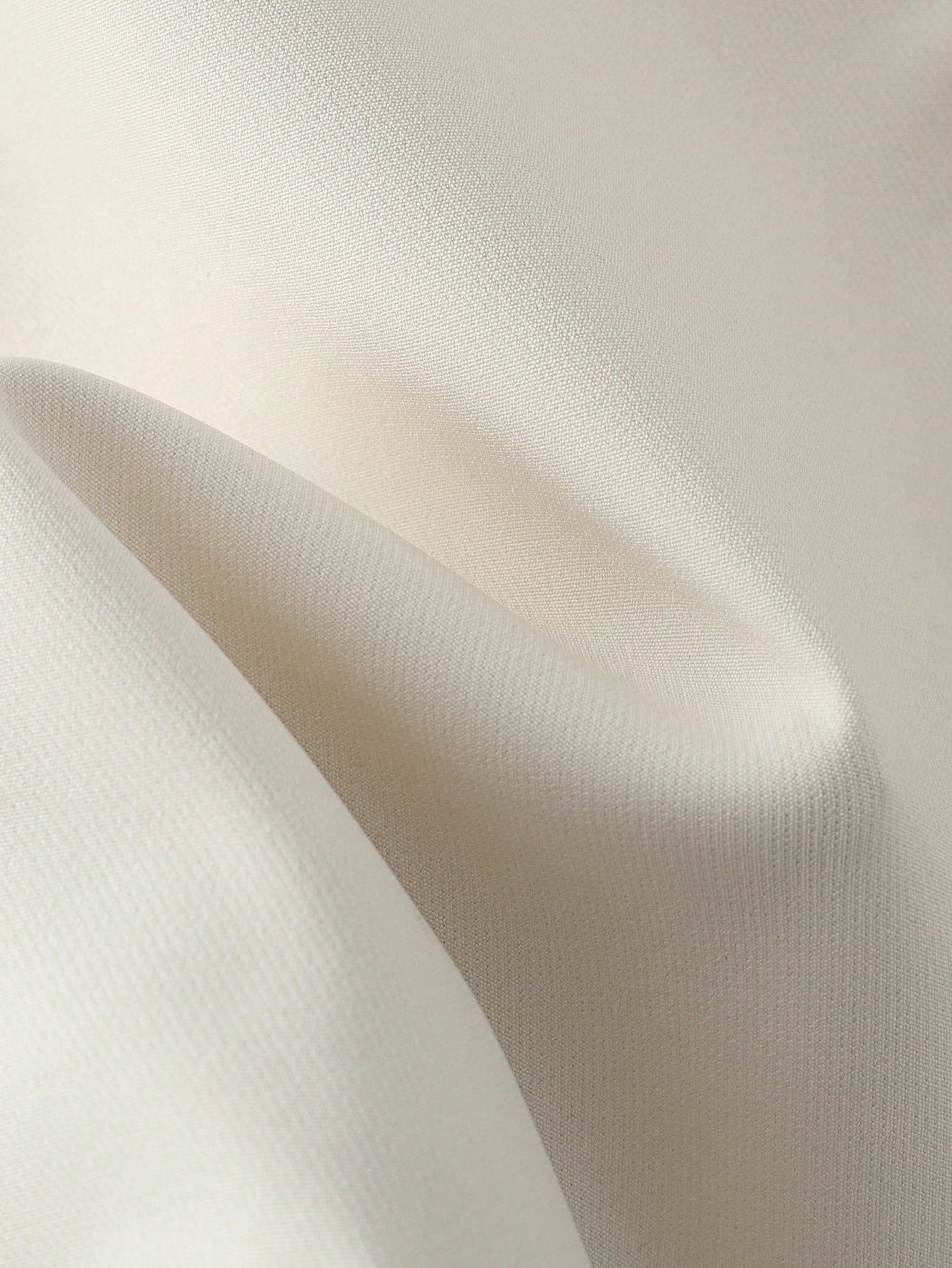 Close-up of beige fabric with a subtle texture