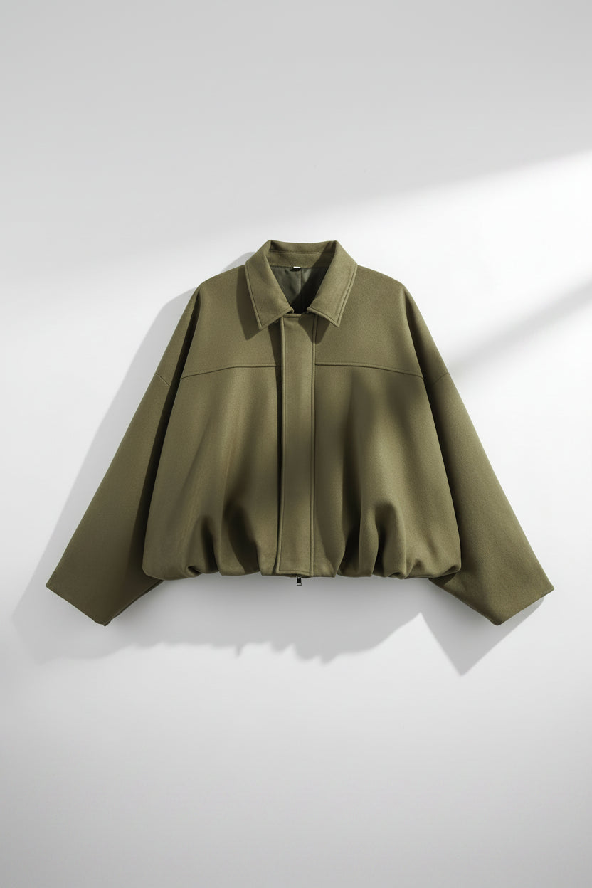 Green cape on a white background