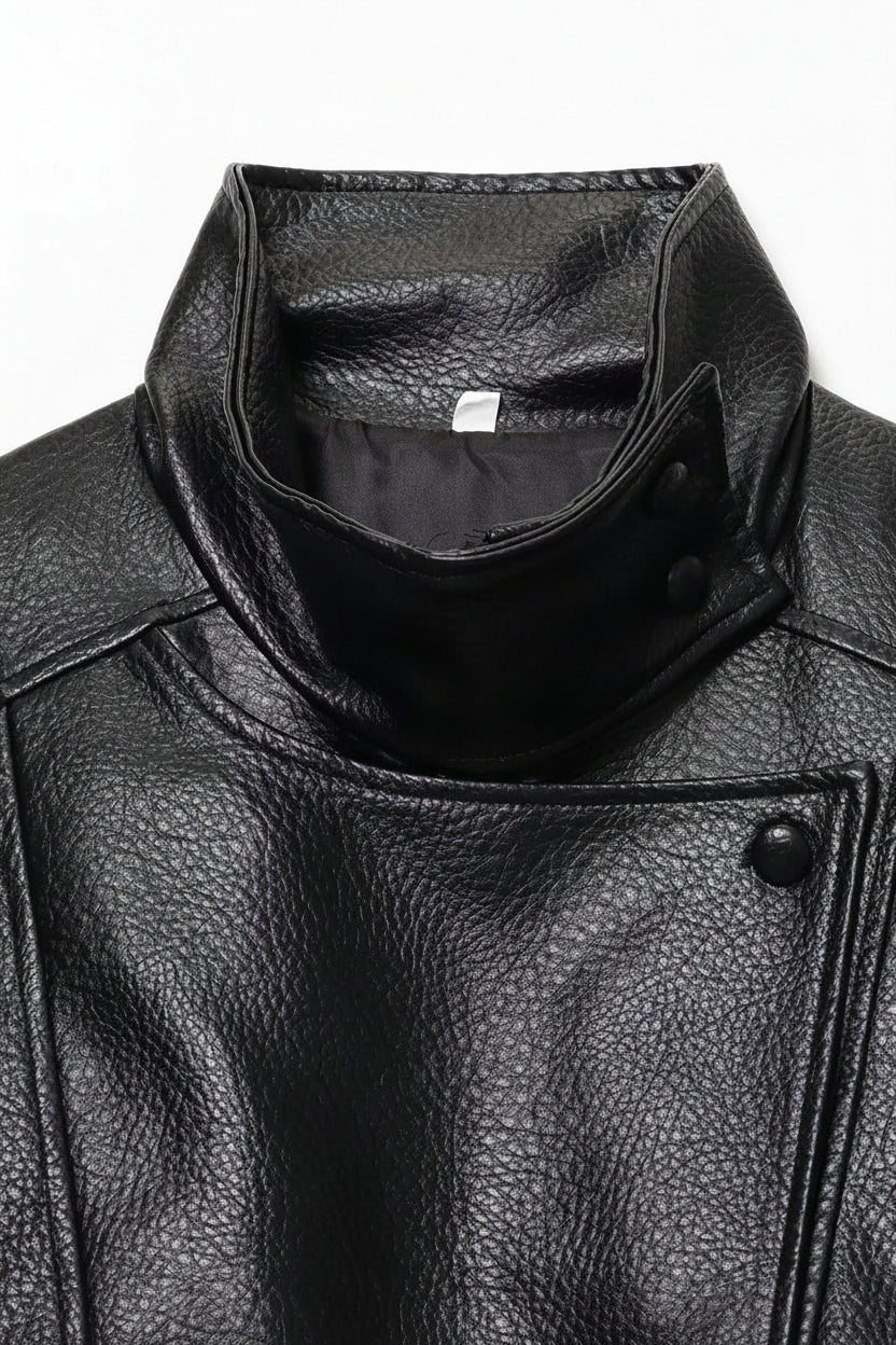 Close-up of a black leather jacket with a brand label visible.