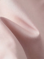 Close-up of pink fabric with a soft texture
