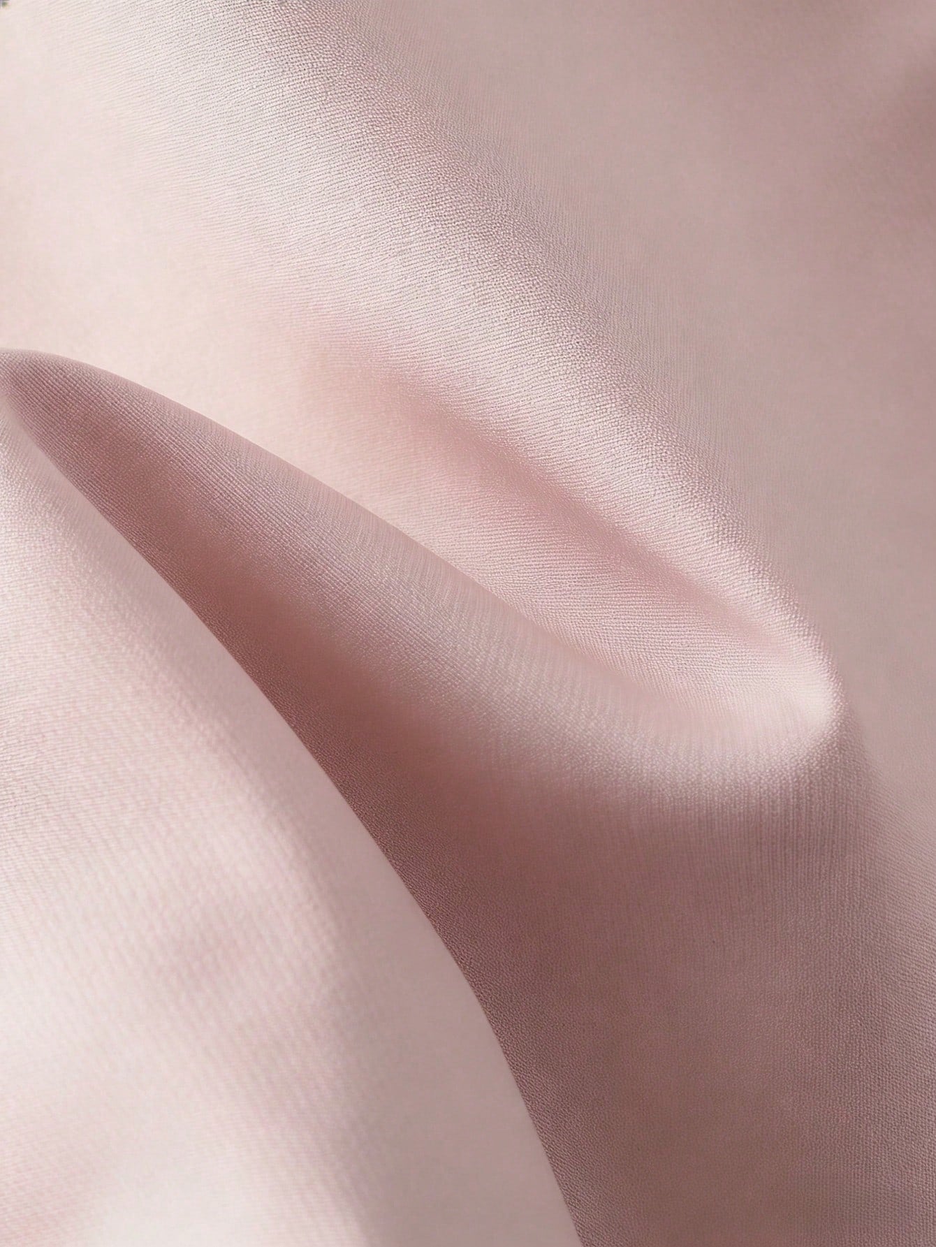 Close-up of pink fabric with a soft texture