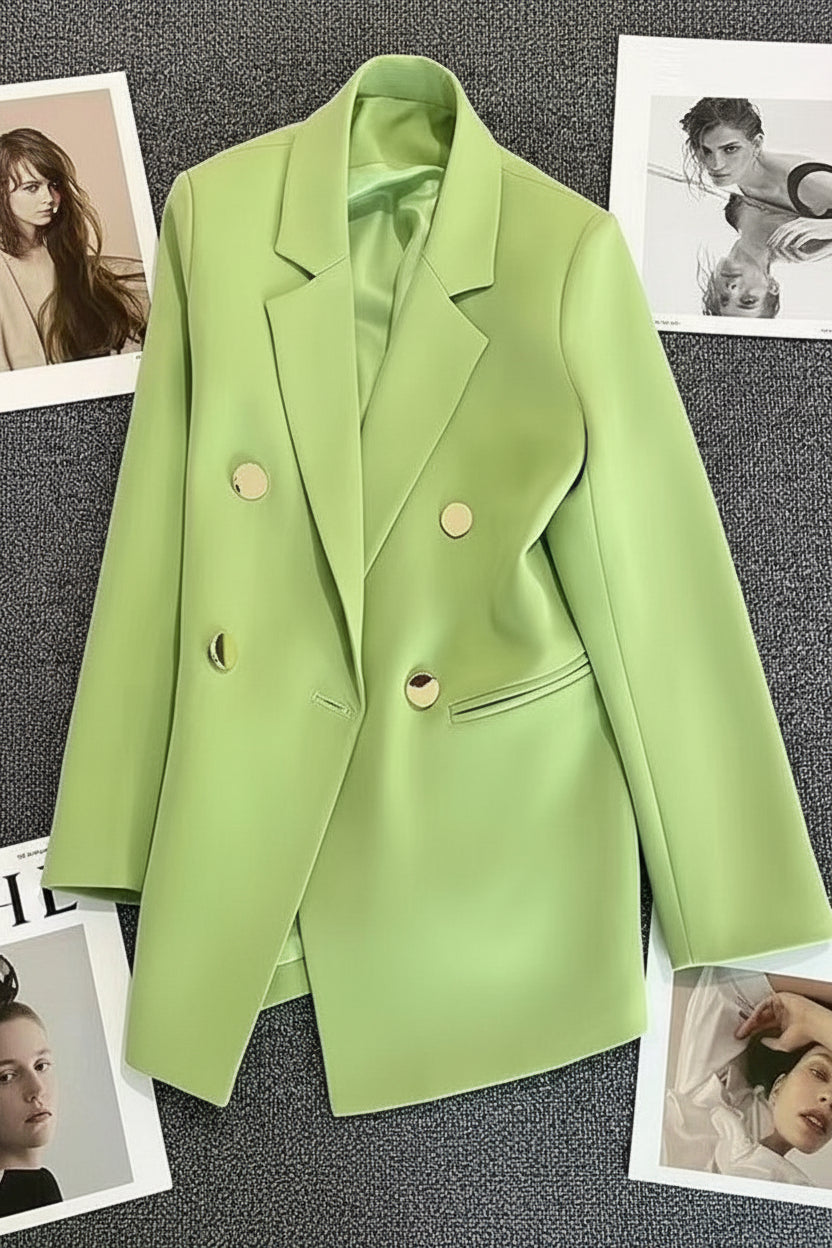 Green blazer on a textured gray background