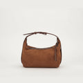 Brown handbag on a light beige background