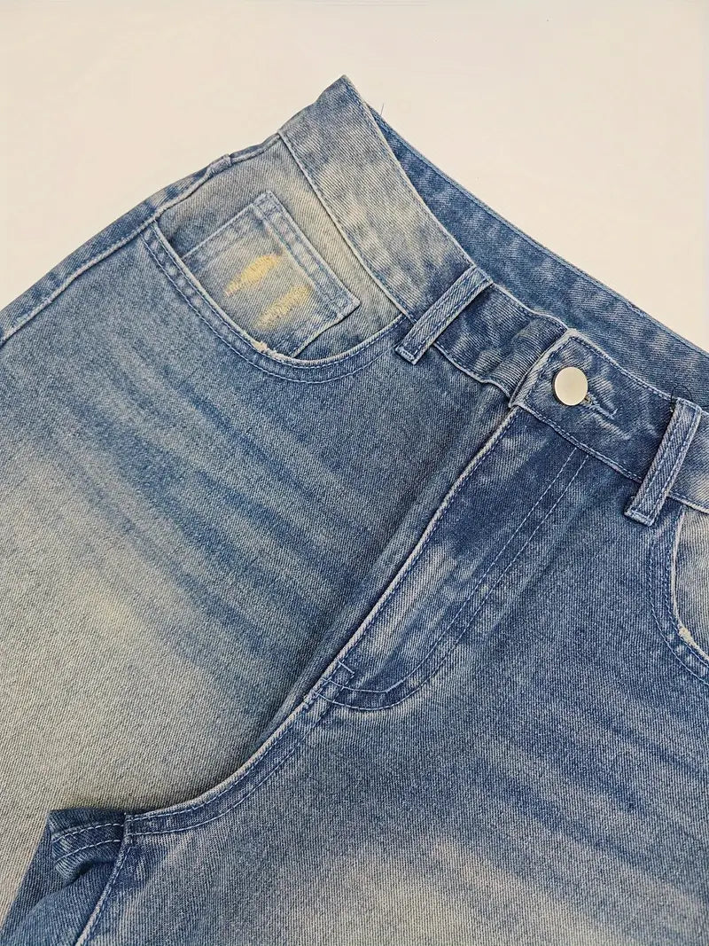 Close-up of a pair of blue jeans on a beige background