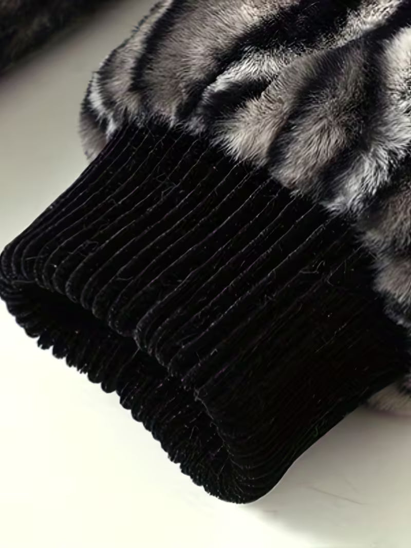 Black ribbed knit fabric with fur trim on a white background
