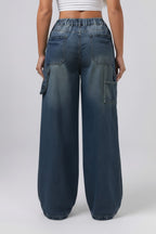 Wide-leg jeans worn by a person on a plain background