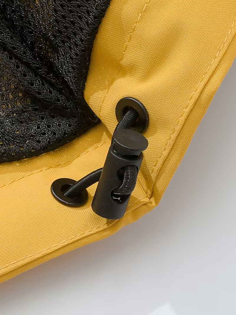 Close-up of a yellow fabric with a black zipper on a white background