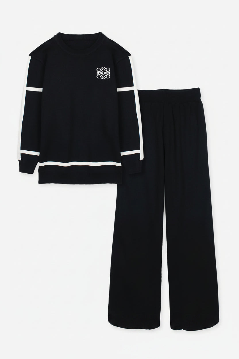 Black outfit with white accents on a white background