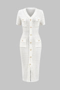 White dress with buttons on a gray background