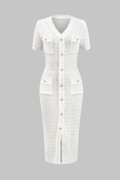 White dress with buttons on a gray background