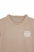 Beige sweater with a white logo on a white background