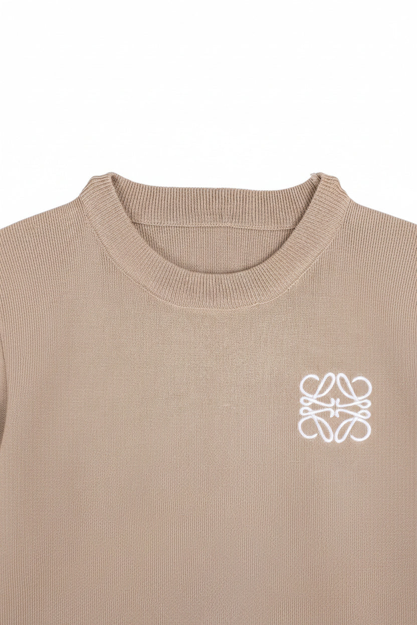 Beige sweater with a white logo on a white background
