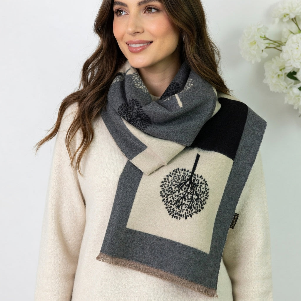Woman wearing a patterned scarf with a white background