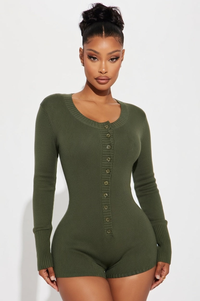 Woman wearing a green ribbed bodysuit against a white background