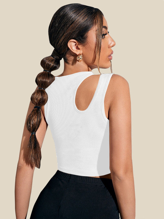 Woman with a side braid wearing a white sleeveless top against a beige background