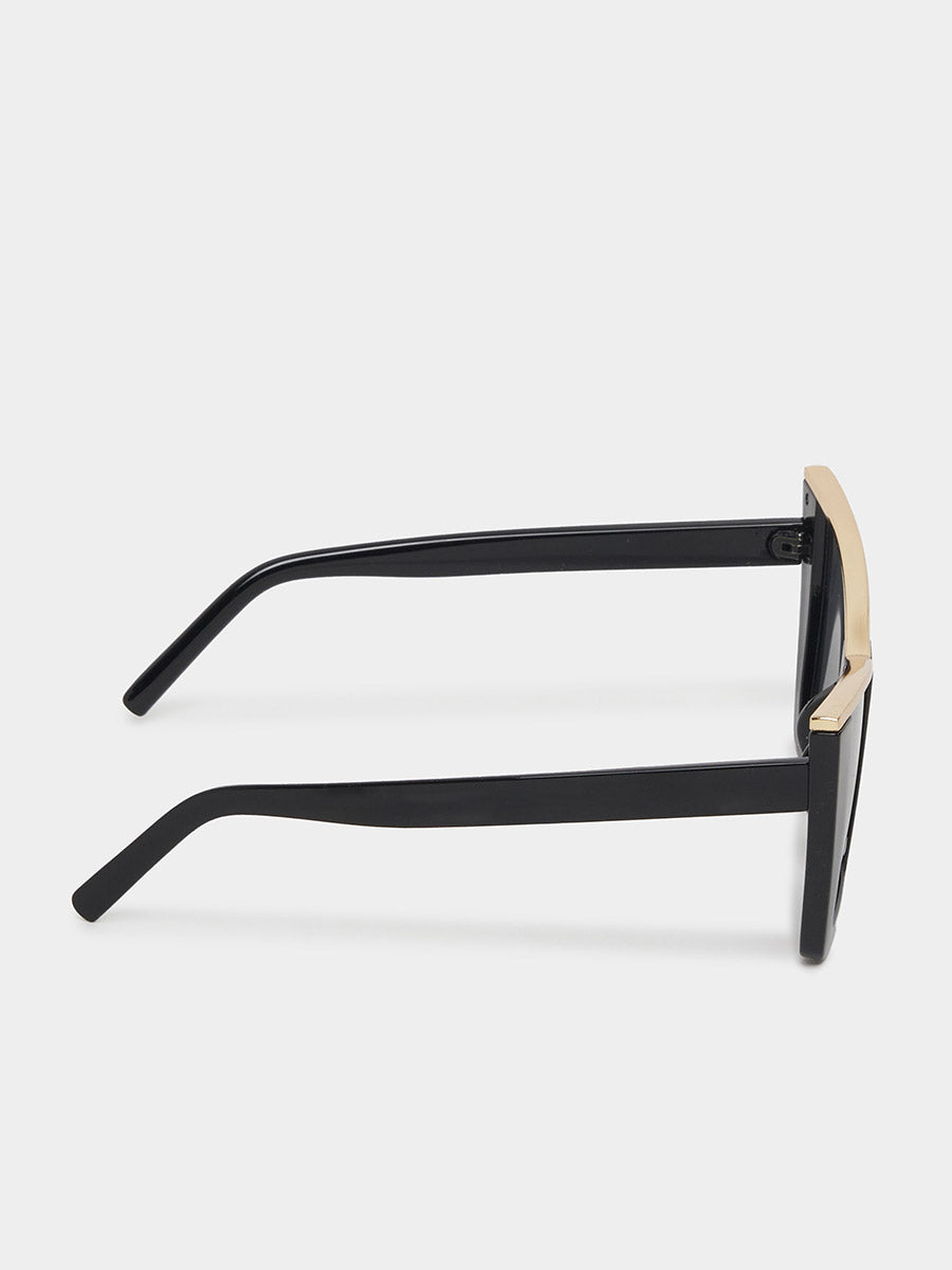 Black sunglasses with gold accents on a white background