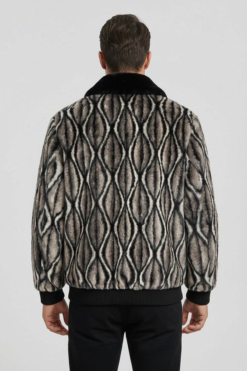 Man wearing a patterned jacket on a plain background