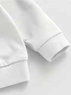 Close-up of a white sweatshirt on a light gray background