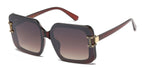 Sunglasses with brown gradient lenses and gold accents on a white background