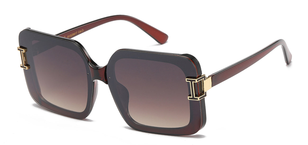 Sunglasses with brown gradient lenses and gold accents on a white background