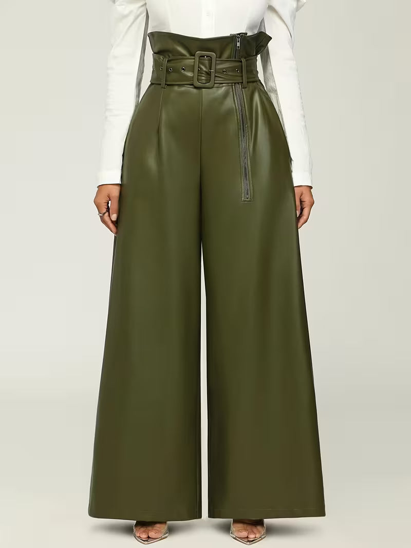 Person wearing olive green wide-leg pants with a belt on a light gray background