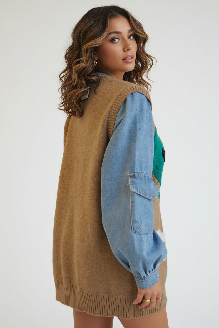 Woman wearing a brown knit vest over a blue denim shirt on a white background