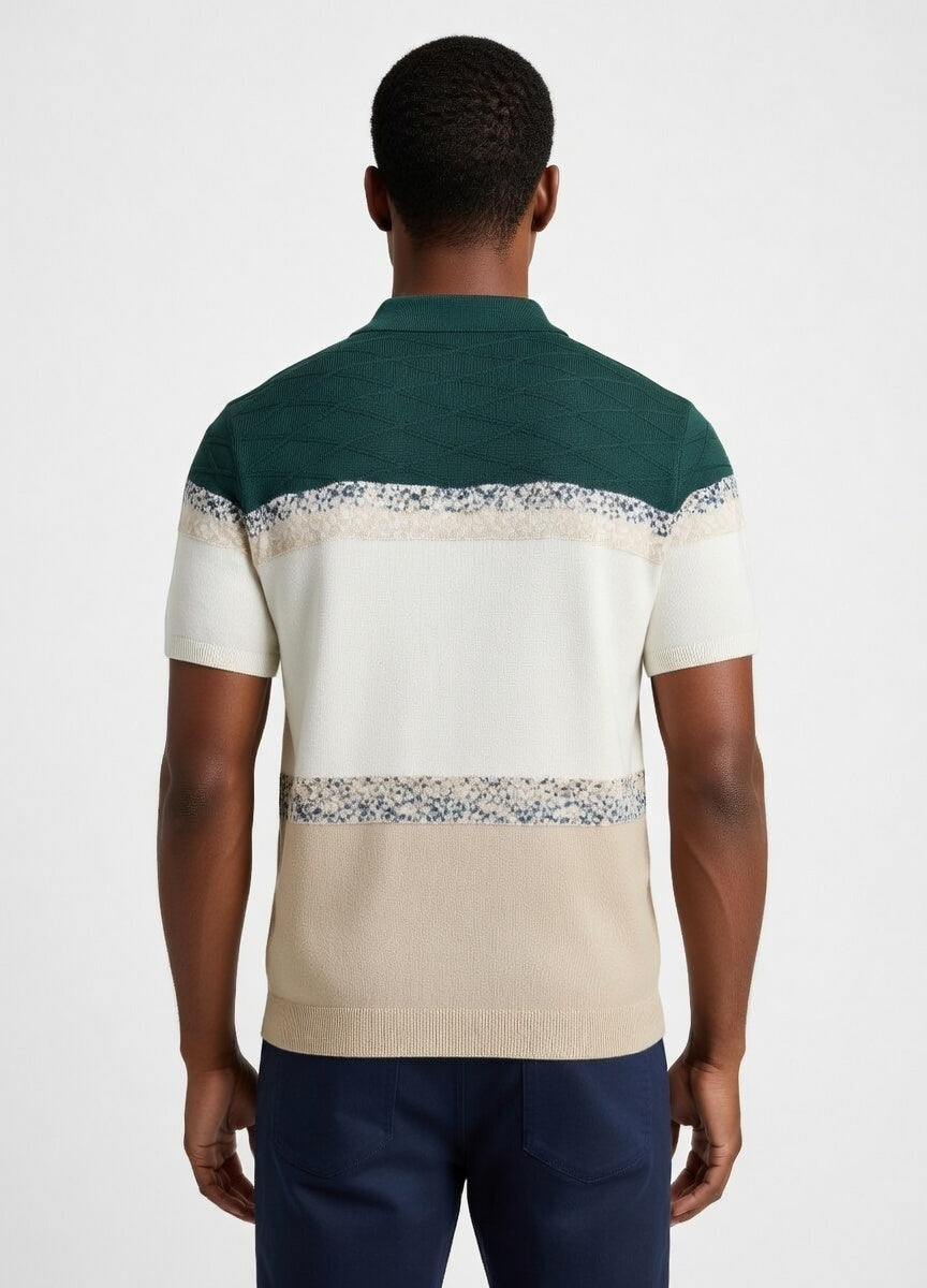 Man wearing a green and beige striped polo shirt with floral patterns on a white background