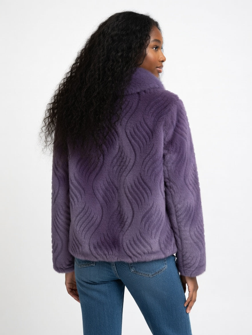Person wearing a purple textured jacket on a white background