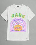 White t-shirt with a colorful graphic design featuring text and a cartoon face on a gray background