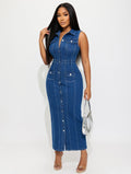 Woman wearing a blue denim jumpsuit on a white background