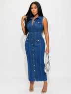Woman wearing a blue denim jumpsuit on a white background