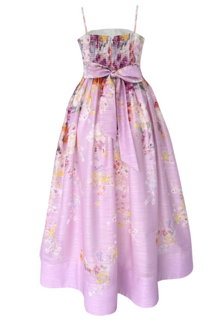 Lavender floral dress with a bow on a white background