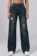 Person wearing blue jeans with a white background