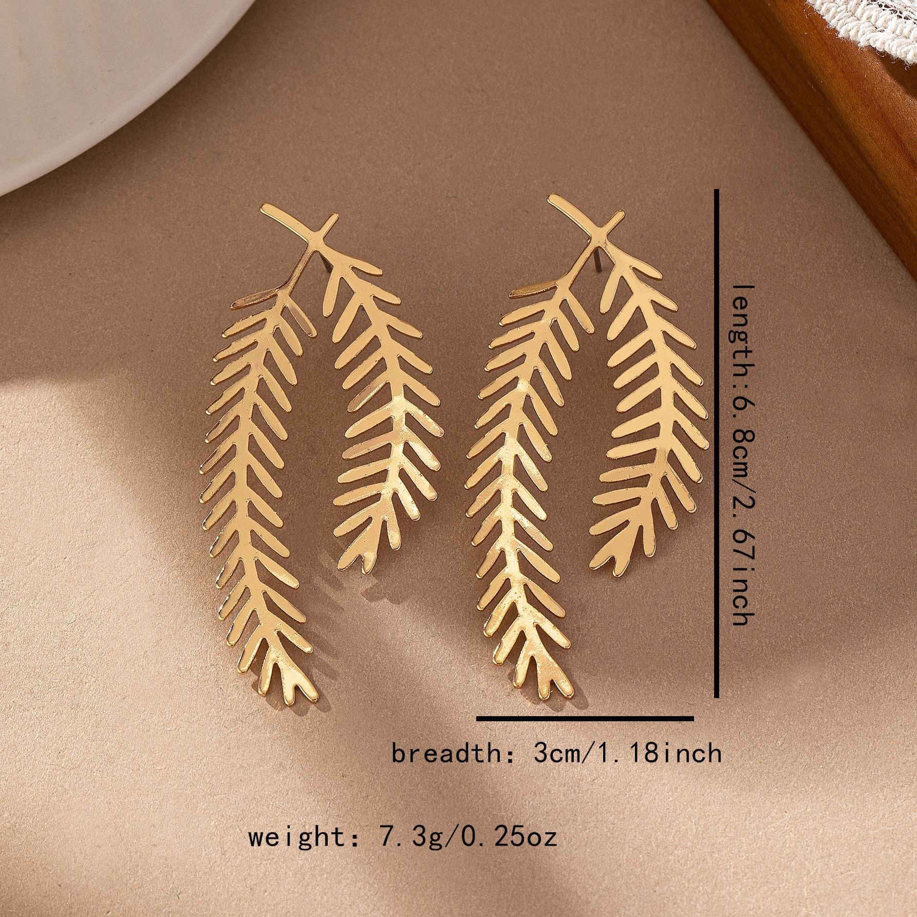 FAVEN Gold leaf-shaped earrings