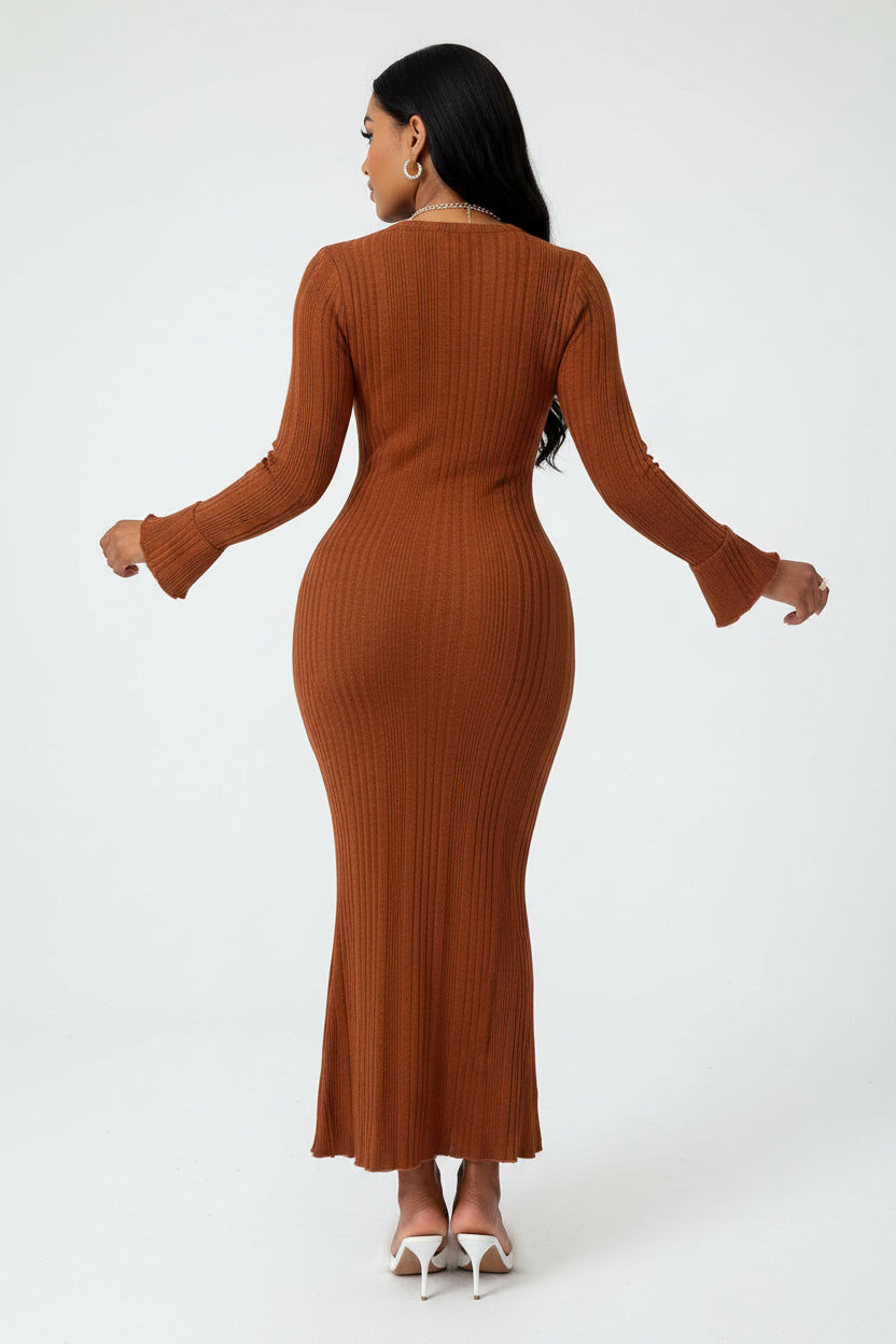 Woman wearing a brown ribbed dress in a white background.