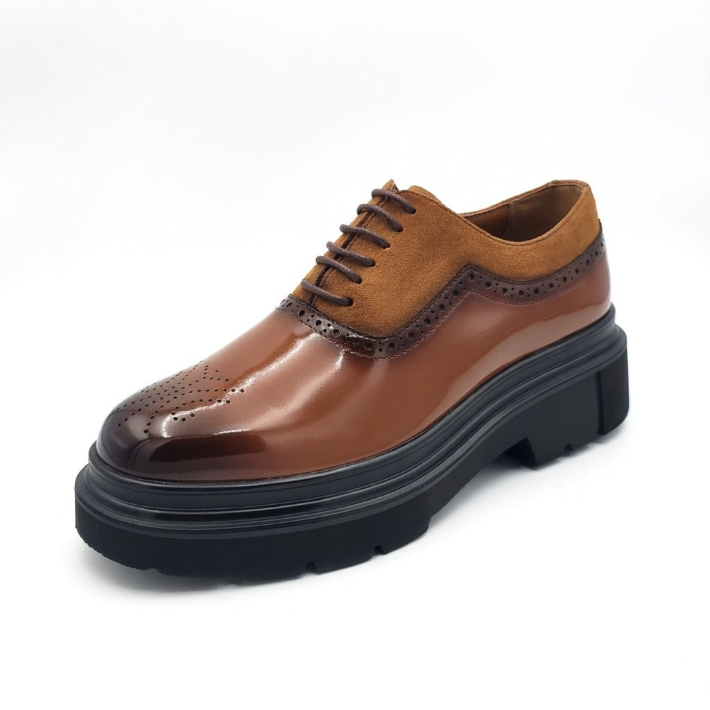 Brown leather shoe with a thick black sole on a white background