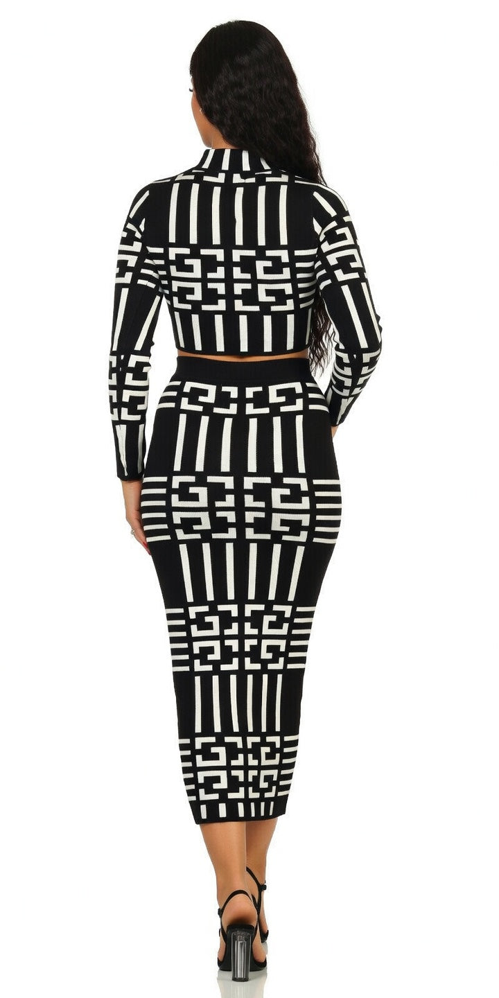 Woman wearing a black and white geometric patterned outfit on a white background