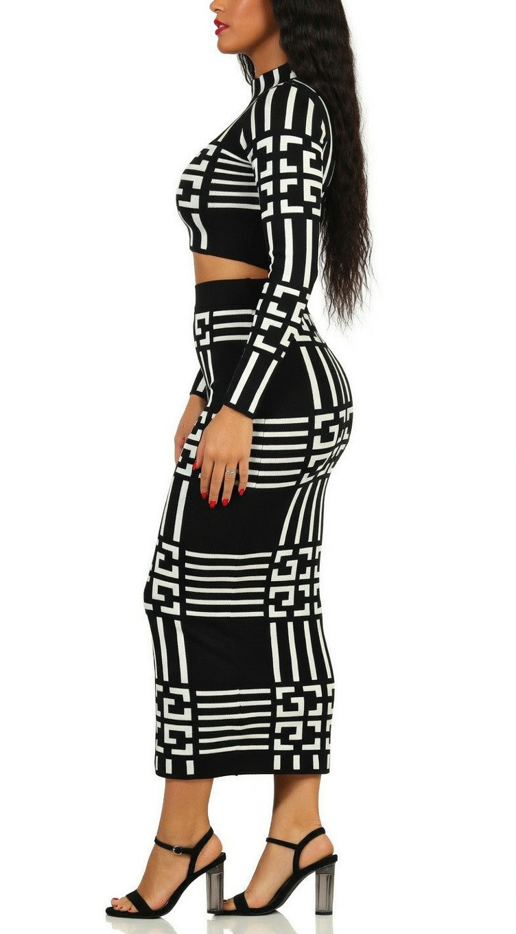 Black and white geometric patterned outfit on a model against a white background