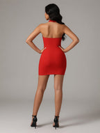 Woman wearing a red dress with a plain background