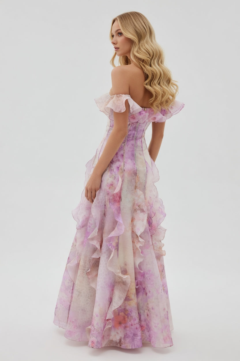 Woman wearing a floral off-shoulder dress on a white background