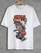 White t-shirt with a graphic design of a werewolf on a skateboard and 'Chills and Thrills' text, hanging on a wooden hanger against a gray background.