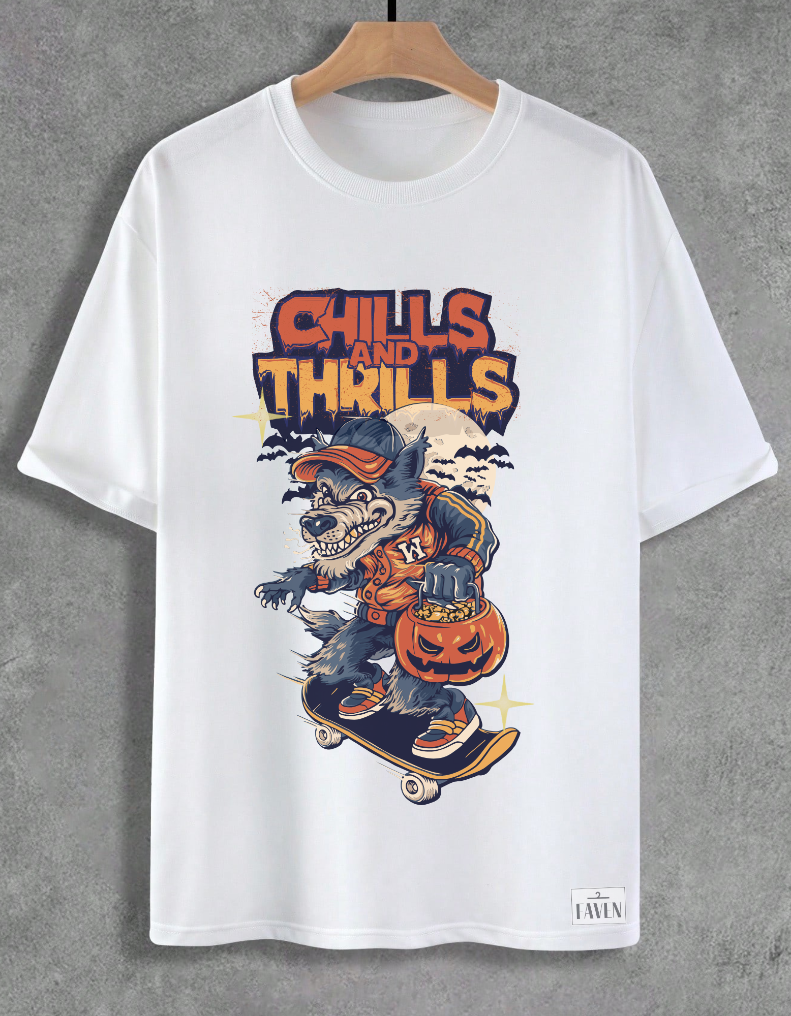 White t-shirt with a graphic design of a werewolf on a skateboard and 'Chills and Thrills' text, hanging on a wooden hanger against a gray background.