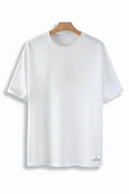 White t-shirt on a wooden hanger against a gray background