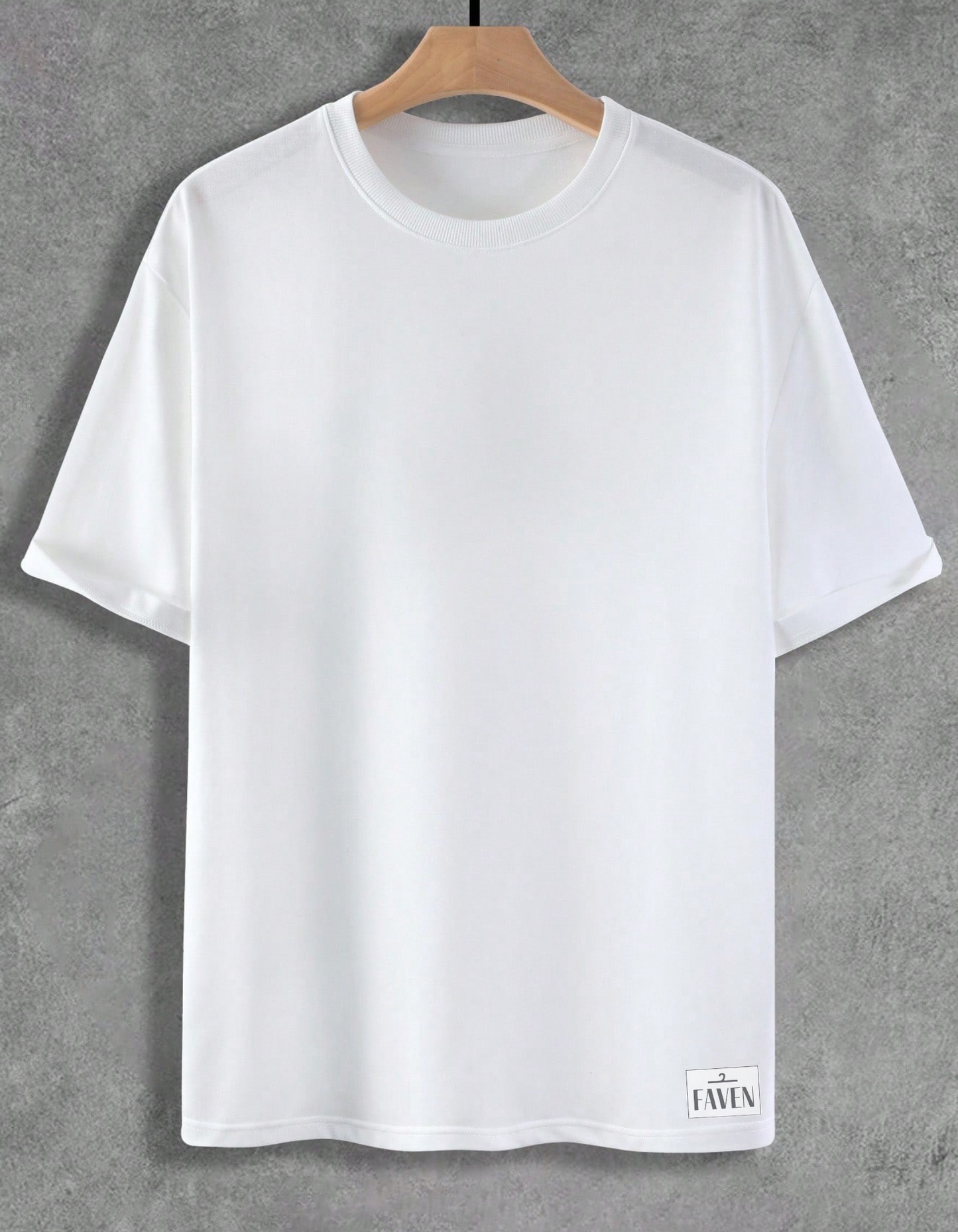 White t-shirt on a wooden hanger against a gray background
