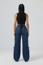 Blue jeans worn by a person on a white background