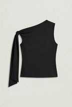 a black asymmetric one-shoulder sleeveless top with subtle neck gathering and a draped tie detail on the left shoulder