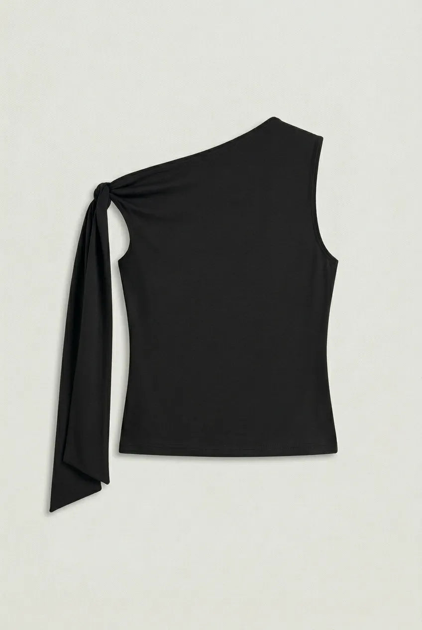 a black asymmetric one-shoulder sleeveless top with subtle neck gathering and a draped tie detail on the left shoulder