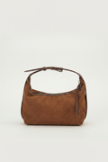 Brown handbag on a light beige background