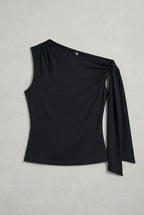 a black asymmetric one-shoulder sleeveless top with subtle neck gathering and a draped tie detail on the left shoulder