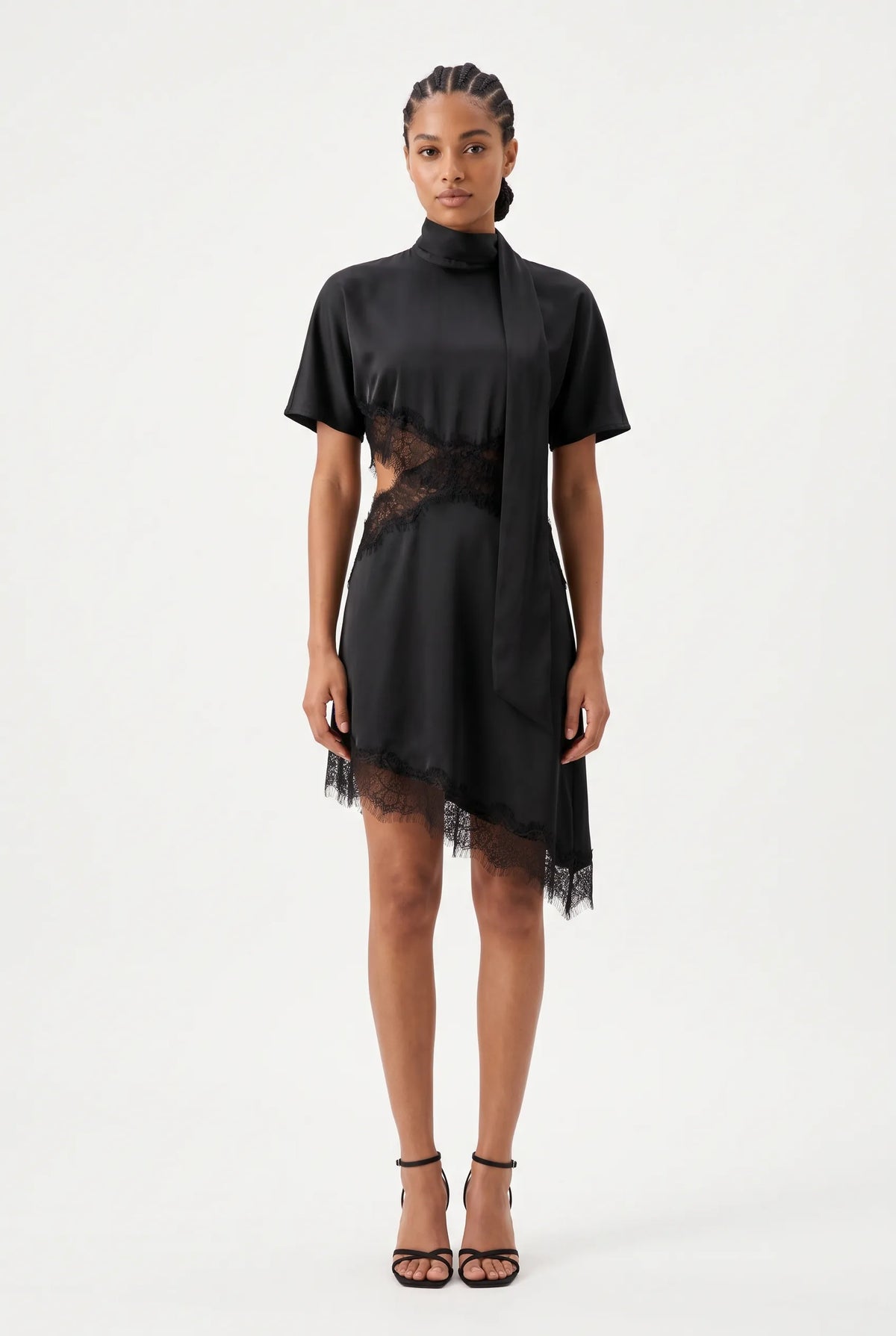 Modern short-sleeved mini dress features an elegant high-neck collar with an attached, long trailing scarf tie that drapes fluidly down the front. Designed with a contemporary midsection cut-out, the edges of the waist, bodice, and asymmetrical hemline are embellished with delicate, intricate eyelash lace trim for a sensual, sheer contrast. The fluid skirt falls into an asymmetrical high-low hem finish, combining structured, high-fashion tailoring with romantic boudoir-inspired details.